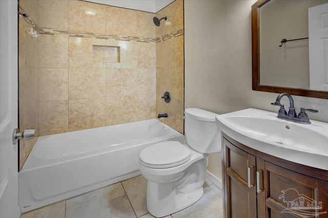 full bathroom featuring toilet, tiled shower / bath combo, vanity, and tile patterned floors