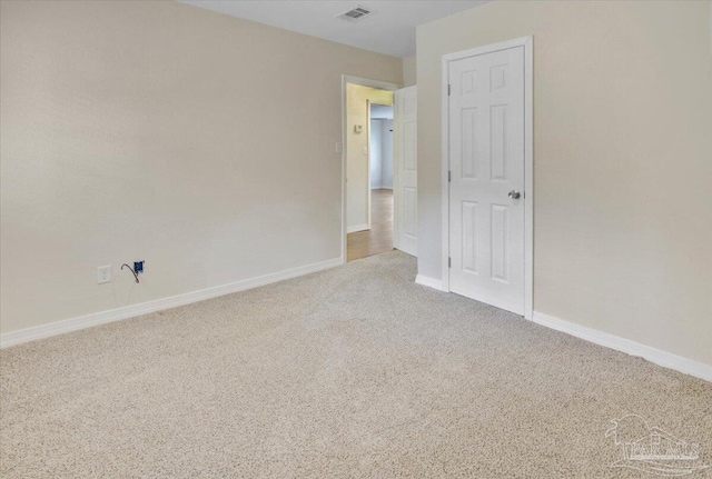 unfurnished room with light colored carpet