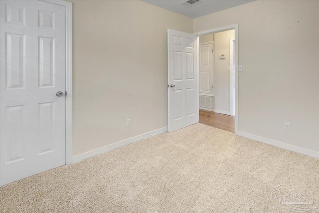 unfurnished bedroom with light carpet