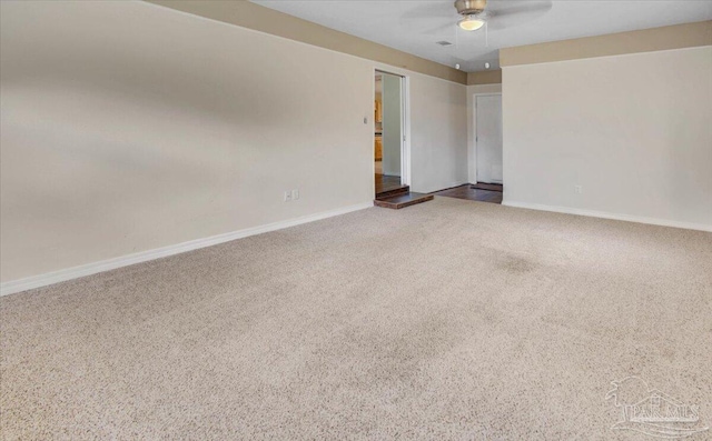 unfurnished room with ceiling fan and carpet floors