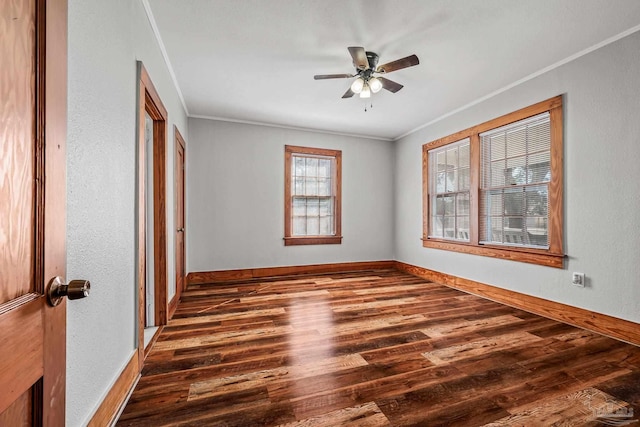 unfurnished bedroom with ornamental molding, baseboards, and wood finished floors