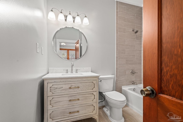 full bath featuring toilet, shower / bathing tub combination, and vanity