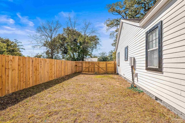 view of yard with a fenced backyard