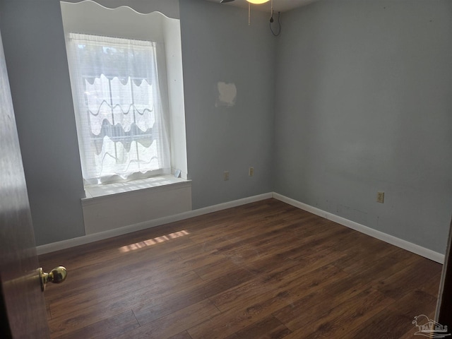 3285 Fairview Dr, Crestview, FL 32539 - empty room featuring dark wood-style floors, baseboards, and a ceiling fan