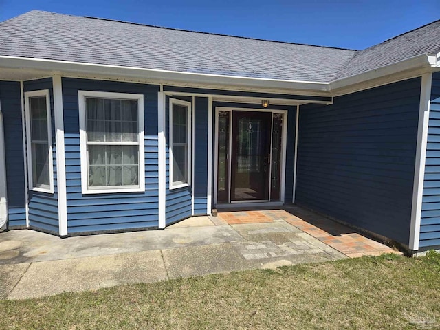 3285 Fairview Dr, Crestview, FL 32539 - entrance to property with a shingled roof and a patio area
