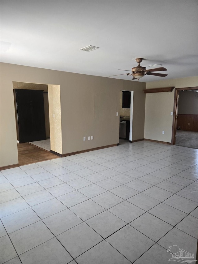 3285 Fairview Dr, Crestview, FL 32539 - unfurnished room featuring baseboards, visible vents, light tile patterned floors, and a ceiling fan
