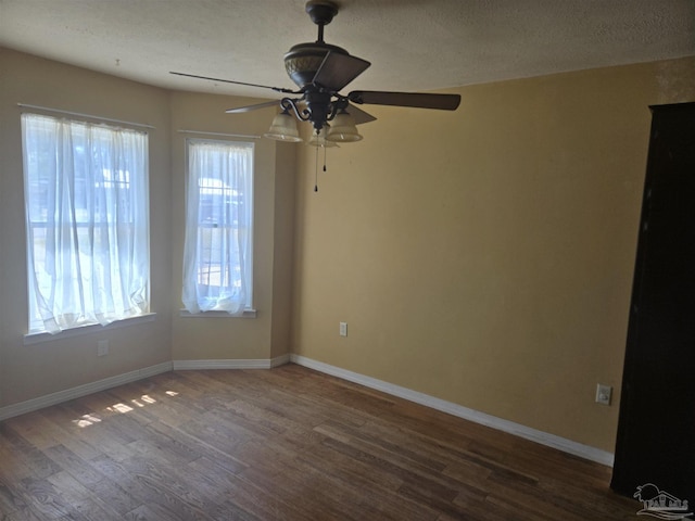 3285 Fairview Dr, Crestview, FL 32539 - unfurnished room with dark wood-style flooring, plenty of natural light, and baseboards