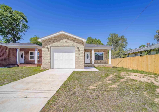 view of front of home featuring a garage and a front lawn