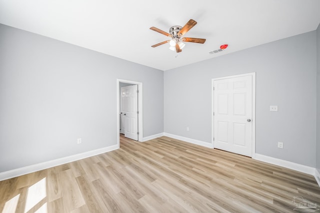 unfurnished bedroom with light hardwood / wood-style floors and ceiling fan