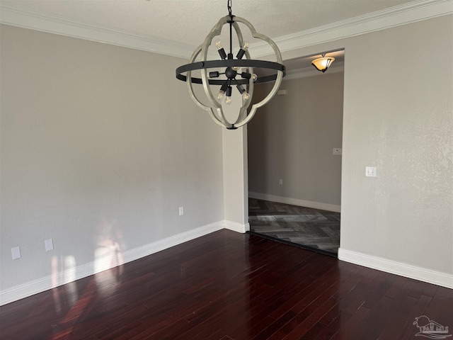 unfurnished dining area with crown molding, dark hardwood / wood-style flooring, and a chandelier