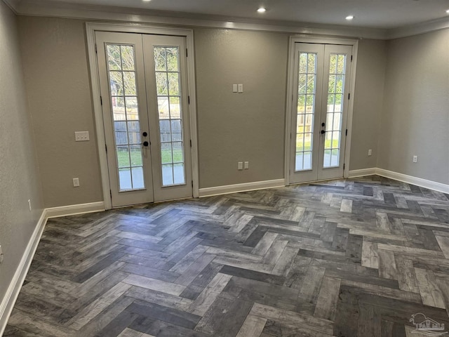 entryway with french doors, dark parquet flooring, plenty of natural light, and ornamental molding