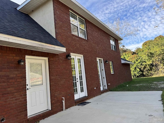 view of property exterior with a patio area