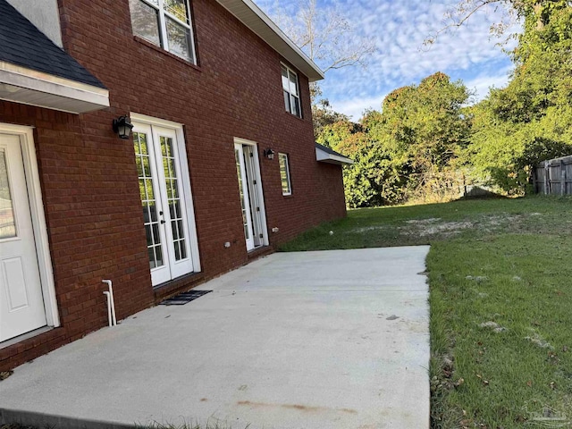 exterior space featuring a patio area and a lawn