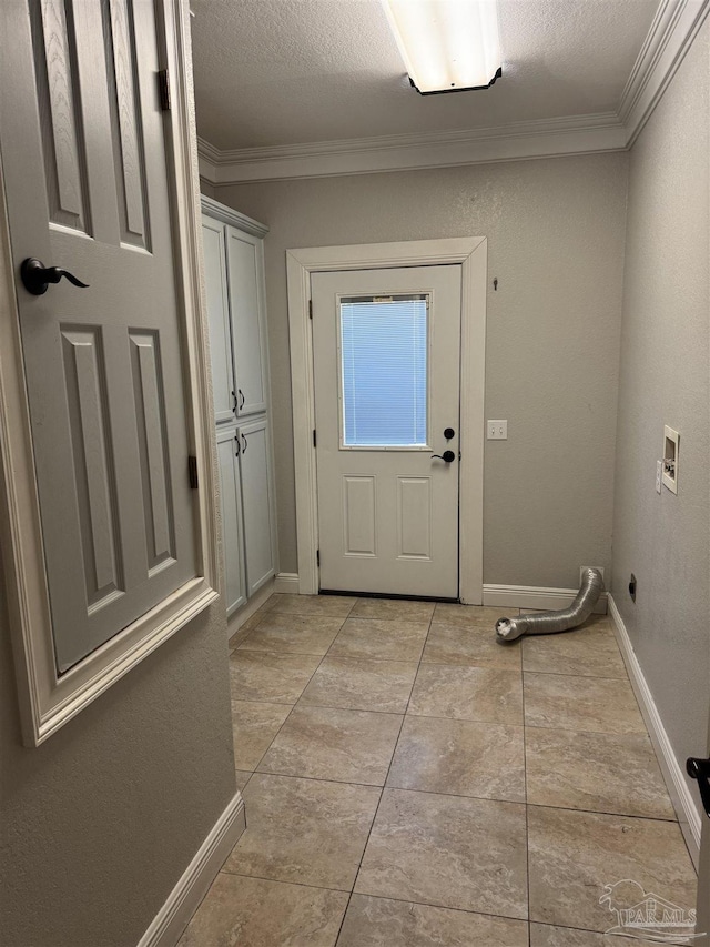 doorway with light tile patterned floors, a textured ceiling, and crown molding