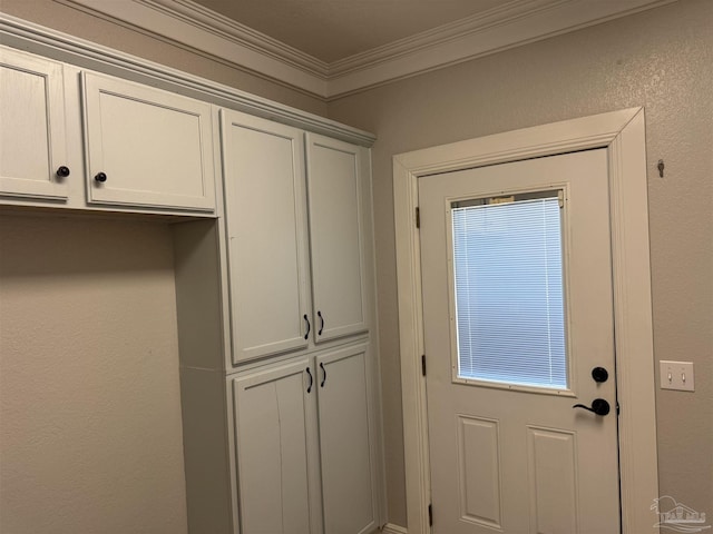 doorway to outside with crown molding