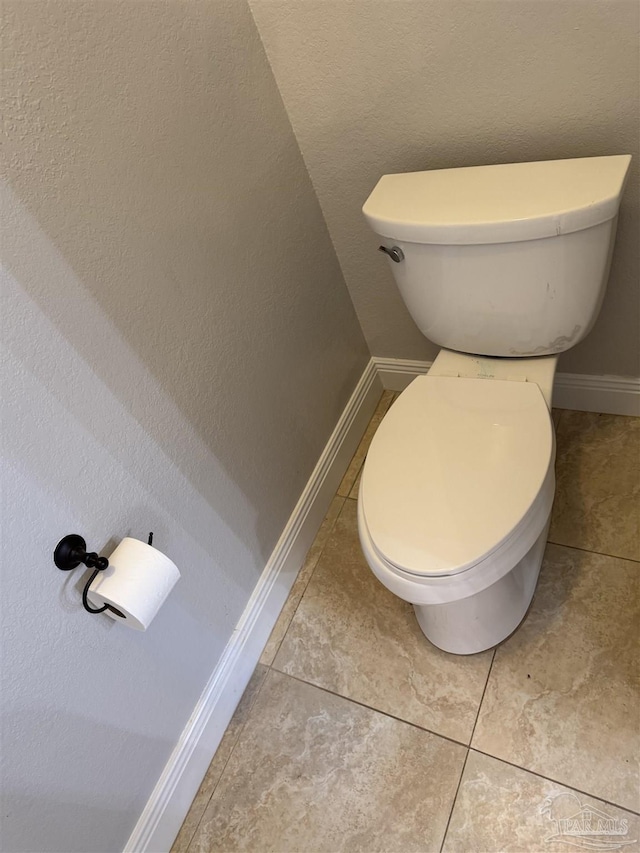 bathroom with tile patterned floors and toilet