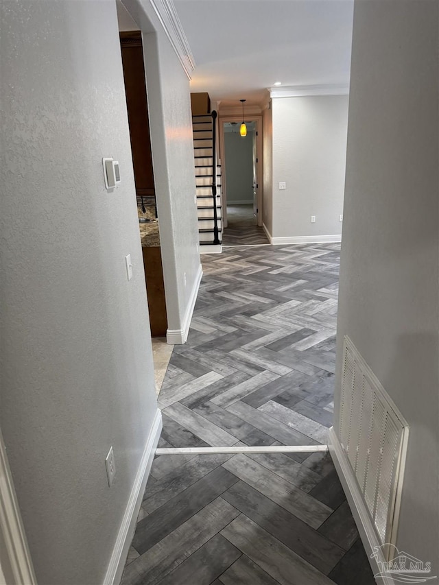 hall featuring hardwood / wood-style flooring and ornamental molding