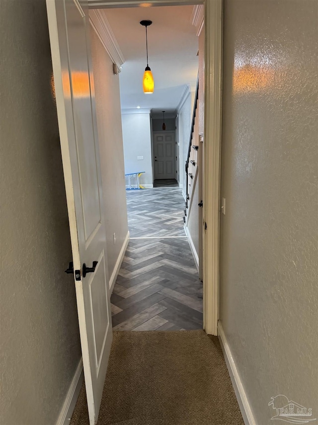 hallway with ornamental molding and parquet floors