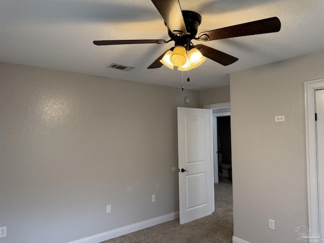 unfurnished room with carpet, a textured ceiling, and ceiling fan