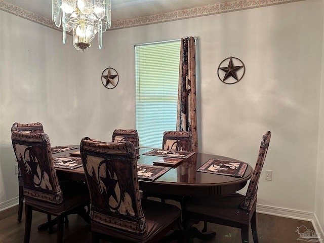 dining room with hardwood / wood-style flooring and a notable chandelier