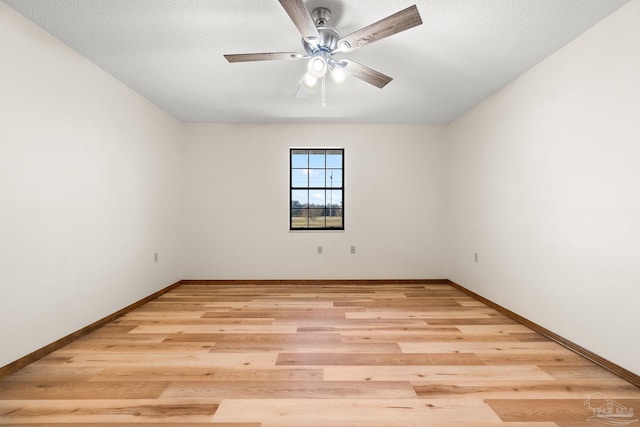 spare room with ceiling fan, a textured ceiling, and light hardwood / wood-style flooring