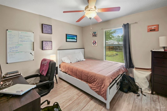 bedroom featuring ceiling fan and light wood-type flooring