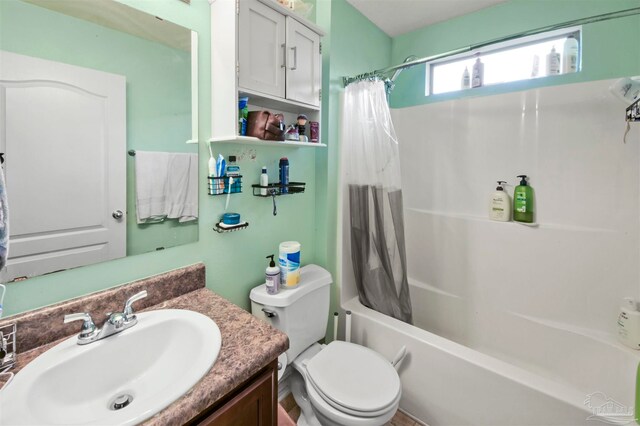 full bathroom featuring shower / tub combo, vanity, and toilet