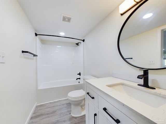 full bathroom with wood-type flooring, vanity, toilet, and shower / bathtub combination