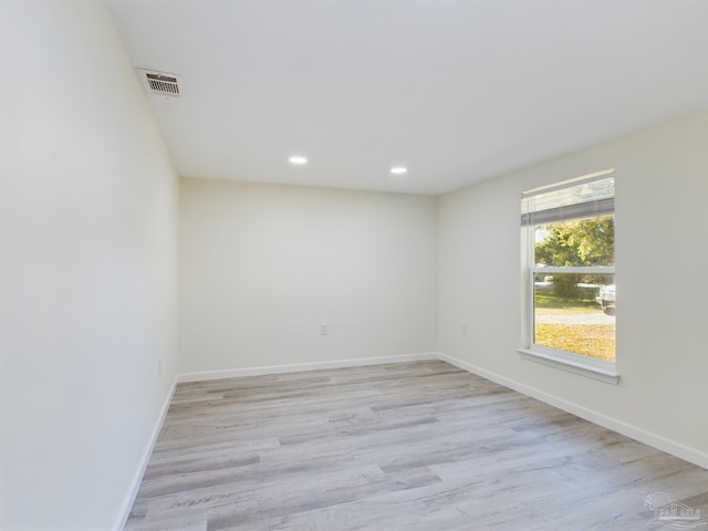 spare room with light wood-type flooring