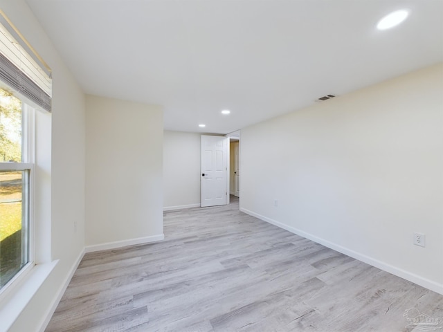 spare room featuring light wood-type flooring