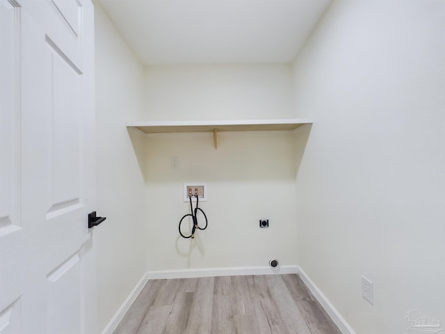 washroom with electric dryer hookup, washer hookup, and light wood-type flooring