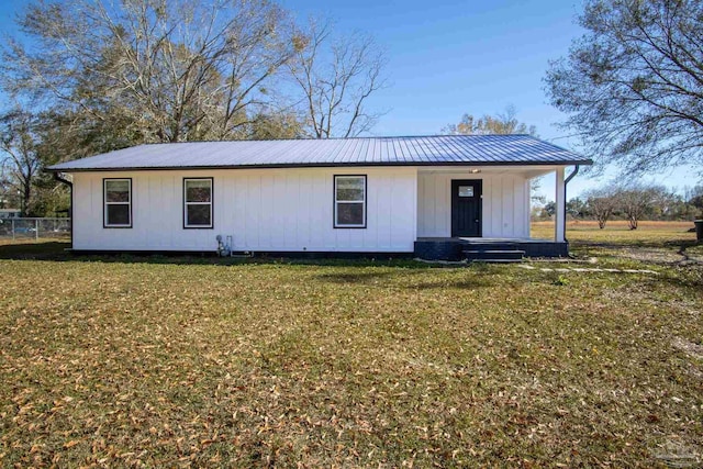 view of front of property with a porch and a front yard