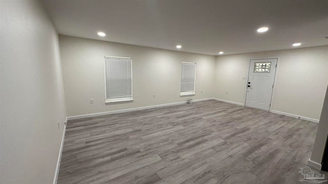 empty room with hardwood / wood-style flooring