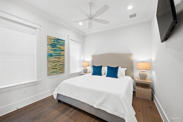 bedroom with ceiling fan, multiple windows, crown molding, and dark hardwood / wood-style floors