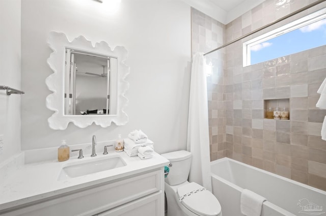 full bathroom with shower / bath combination with curtain, vanity, and toilet