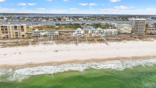 drone / aerial view with a water view and a view of the beach