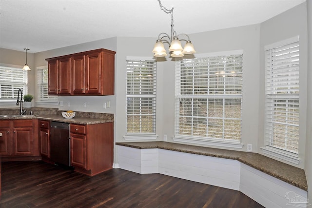 kitchen with a chandelier, dark wood-style flooring, a sink, reddish brown cabinets, and dishwasher