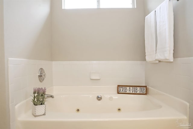 full bathroom with a whirlpool tub