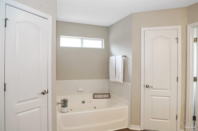 full bath featuring a whirlpool tub