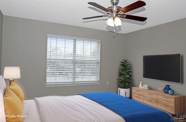 bedroom featuring ceiling fan