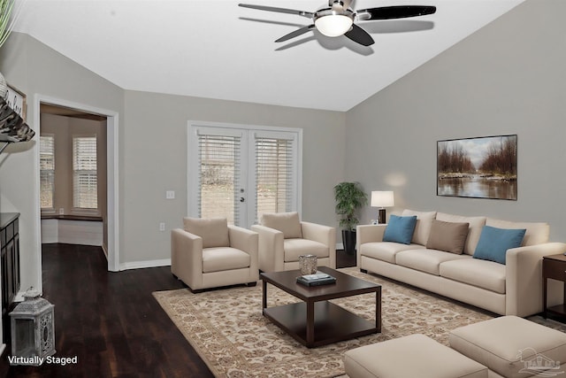 living area featuring french doors, a ceiling fan, vaulted ceiling, wood finished floors, and baseboards