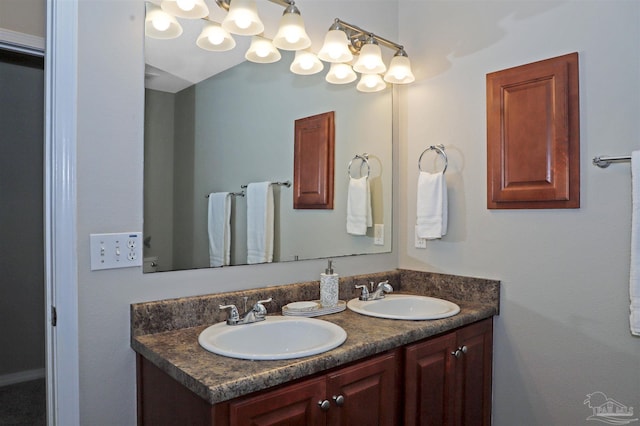 full bathroom with double vanity and a sink