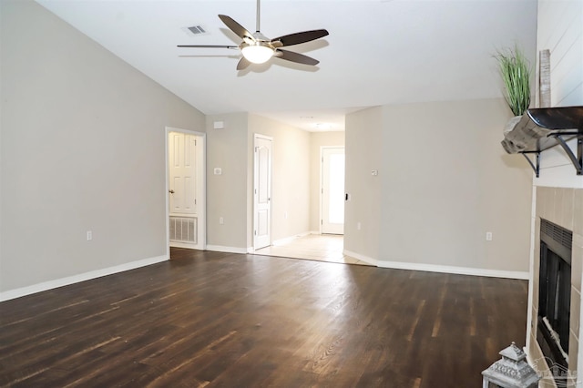 unfurnished living room featuring a fireplace, wood finished floors, and visible vents