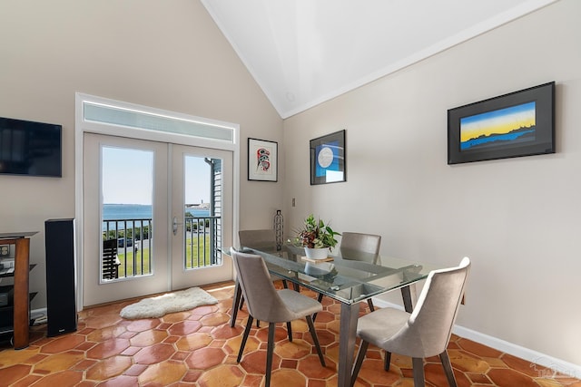 dining room with high vaulted ceiling, french doors, and baseboards