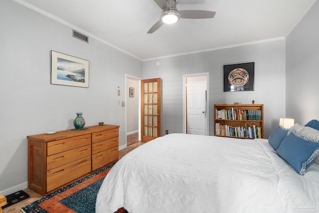 bedroom with ornamental molding, light colored carpet, visible vents, and baseboards