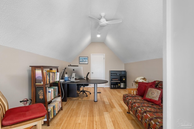 office area with lofted ceiling, ceiling fan, a textured ceiling, and wood finished floors