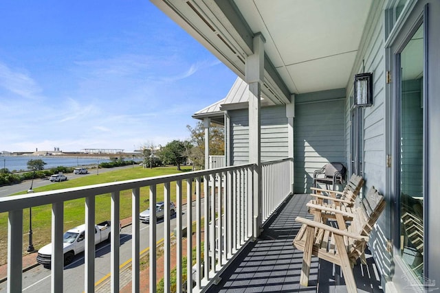 balcony featuring a water view