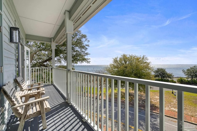 balcony featuring a water view