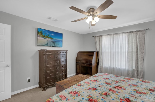 bedroom with carpet floors, visible vents, ceiling fan, and baseboards