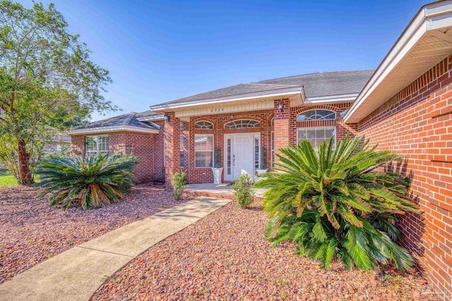 doorway to property featuring covered porch